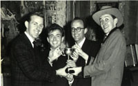 Burns Scandrett, Peter Evans, Watson Raines, and Clive celebrate at a New Zealand Magicians' Convention